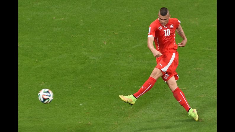 Switzerland midfielder Granit Xhaka scores on a volley in the second half against France on June 20. But France were well ahead by that point, winning 5-2 in Salvador, Brazil.