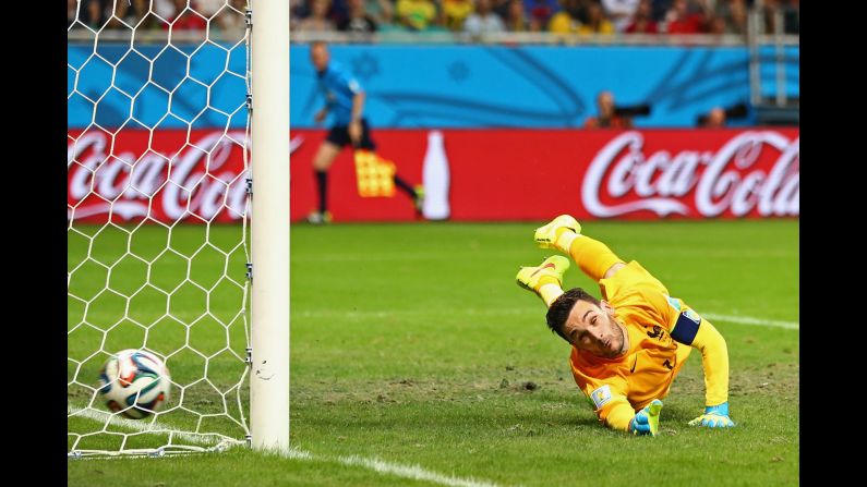 French goalkeeper Hugo Lloris can't get to a free kick from Switzerland's Blerim Dzemaili in the second half. France led 5-0 to that point.