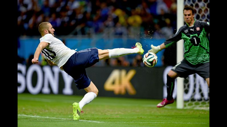 Karim Benzema slips the ball past Swiss goalkeeper Diego Benaglio for France's fourth goal. It was Benzema's third goal of the tournament.