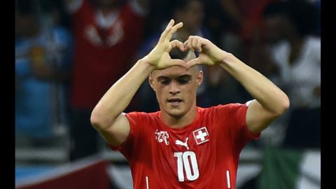 Swiss midfielder Granit Xhaka gestures after scoring his team's second goal late in the second half.