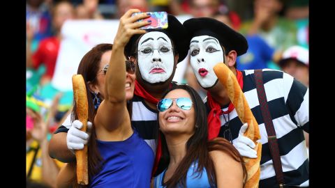 France fans pose for a selfie during the match. 