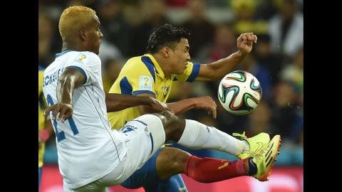 Honduras defender Brayan Beckeles, left, controls the ball during a World Cup match between Honduras and Ecuador at the Baixada Arena in Curitiba, Brazil, on Friday, June 20.  Ecuador defeated Honduras 2-1. 