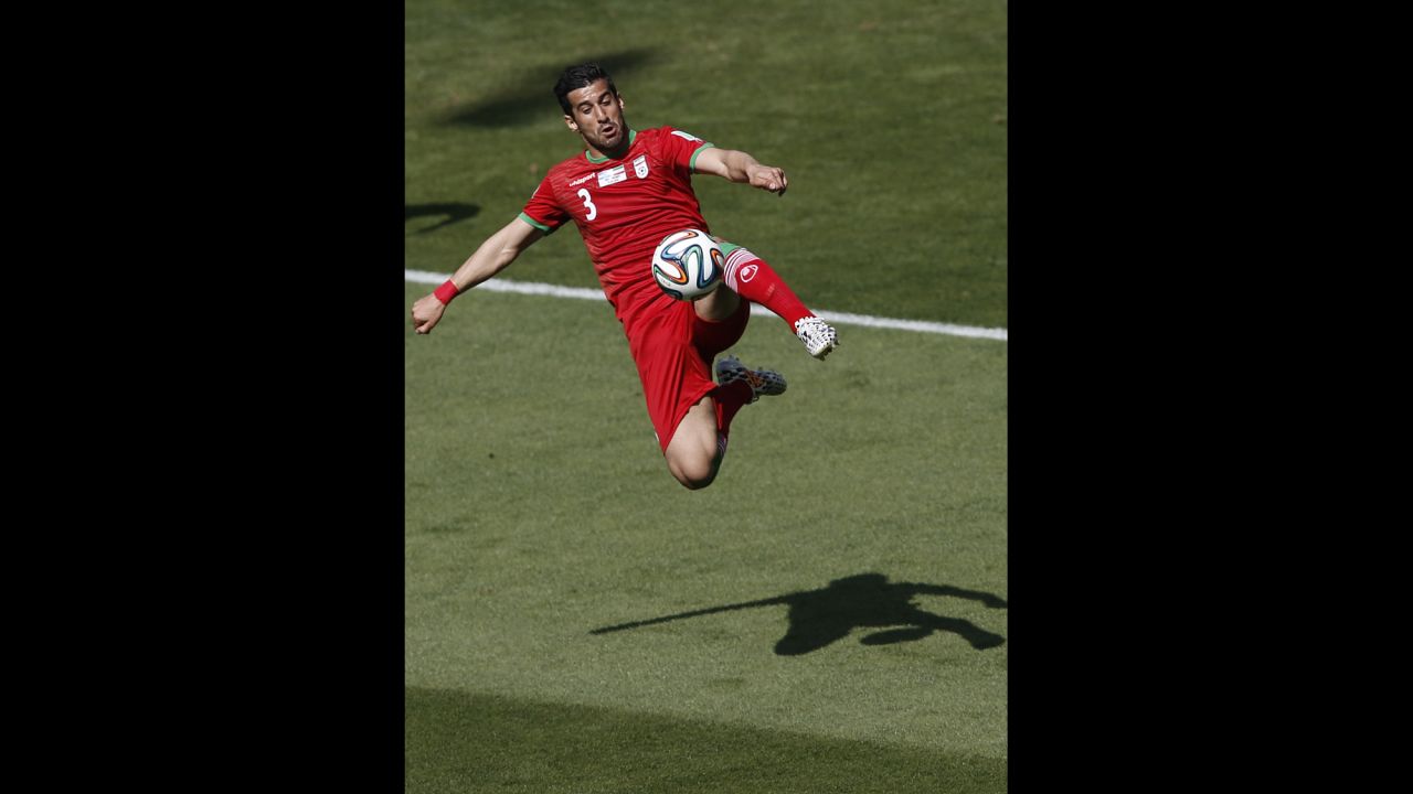 Iran midfielder Ehsan Hajsafi plays the ball.