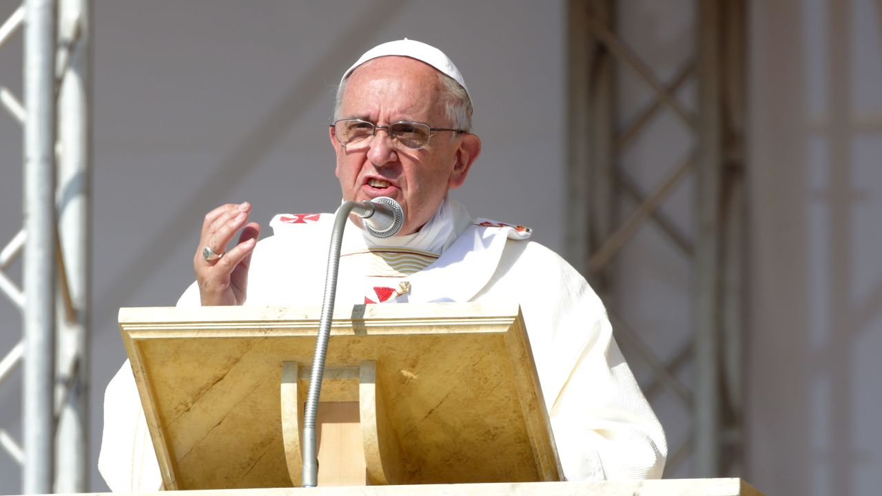  Pope Francis holds his omelia as he attends a mass during the feast-day Mass of Corpus Domini on the plains of the small town of Sibari on June 21, 2014 in Sibari Cosenza, Italy. Pope Francis concluded his one-day trip to the southern Italian region of Calabria with strong words against the Calabrian mafia, calling it 'adoration of evil and contempt for the common good, mafiosi are excommunicated, not in communion with God.'