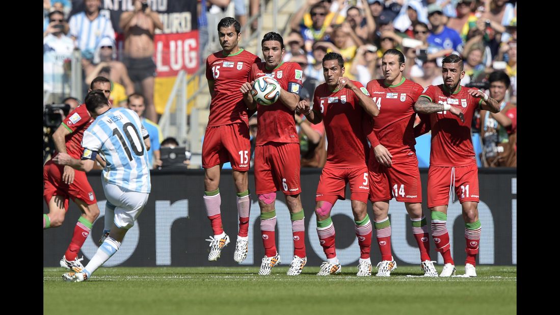Argentina forward and captain Lionel Messi, left, takes a free kick.