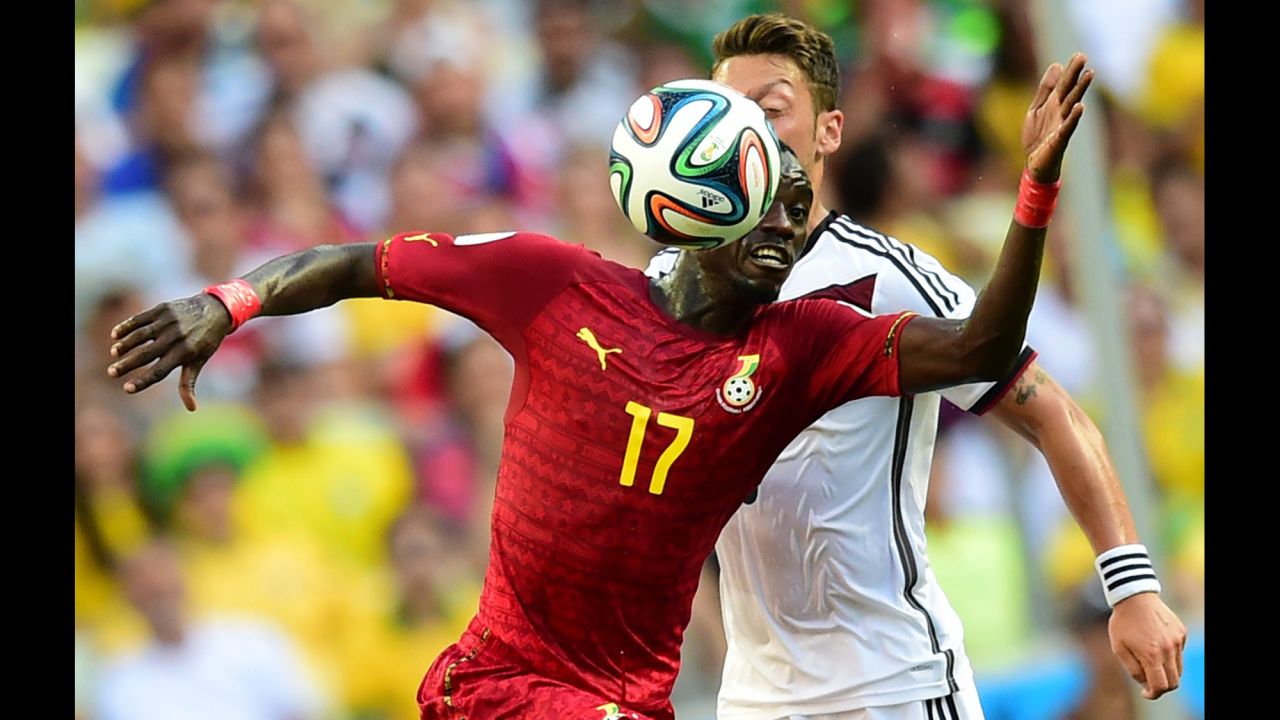 Ghana midfielder Mohammed Rabiu, left, vies with Germany midfielder Mesut Ozil.