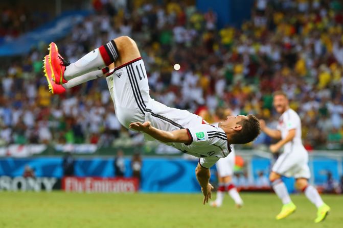 Germany substitute Miroslav Klose does a flip to celebrate after equaling the World Cup record of 15 goals overall, giving his team a 2-2 draw with Ghana on June 21 in Fortaleza, Brazil.