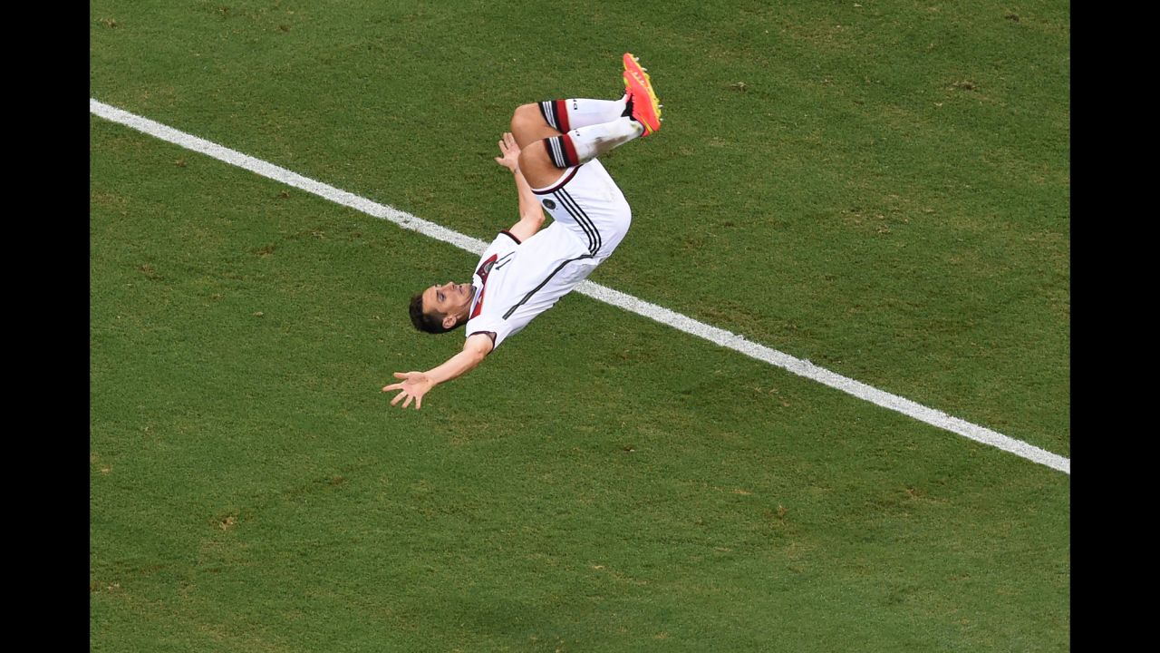Miroslav Klose of Germany does a flip in celebration of scoring his team's second goal. It gave Klose his 15th goal in the World Cup, drawing him level with Brazilian great Ronaldo for the scoring record.