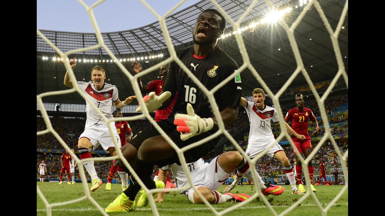 Ghana's goalkeeper Fatau Dauda reacts as he fails to save a goal.
