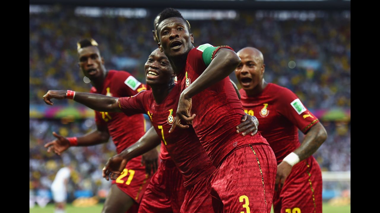 Asamoah Gyan of Ghana celebrates scoring his team's second goal with teammates.  It was his fifth goal in World Cup finals, equaling the African record held by the great Roger Milla of Cameroon.