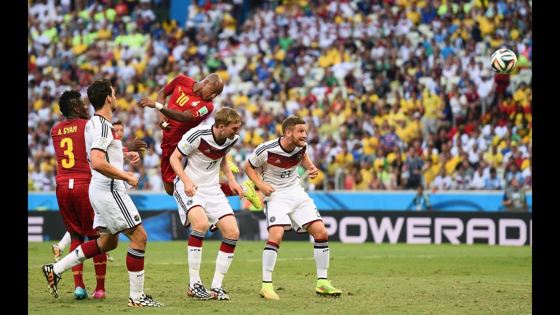 Andre Ayew of Ghana scores his team's first goal on a header over Per Mertesacker and Shkodran Mustafi of Germany.