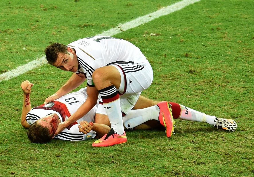 Germany forward Miroslav Klose, right, checks Germany forward Thomas Muller after a collision during a World Cup match against Ghana at Castelao Stadium in Fortaleza, Brazil. The game ended in a 2-2 draw. 