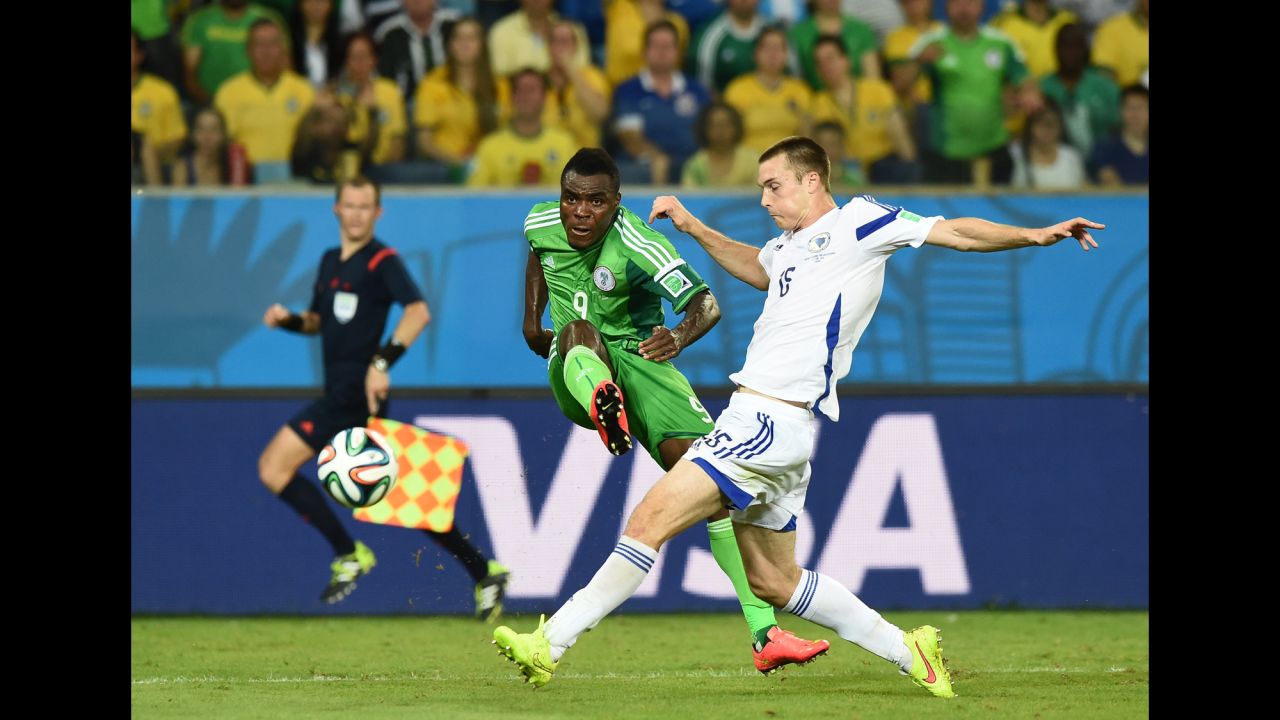 Bosnia defender Toni Sunjic challenges Nigeria forward Emmanuel Emenike.