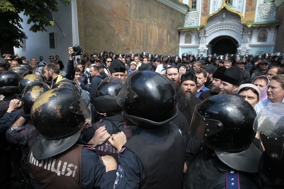 Riot police surround the Kiev Pechersk Lavra, an Orthodox Christian monastery in Kiev where radical masked activists gather to protest against separatists on June 22.