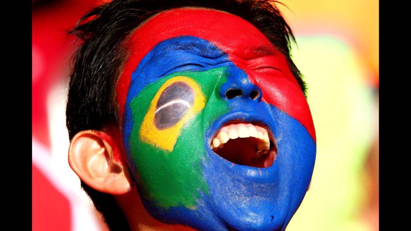 A South Korea fan cheers shows his support.