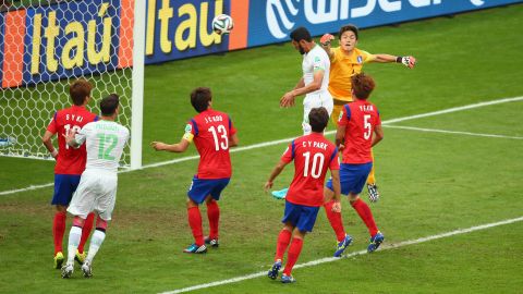 Algeria's Rafik Halliche scores the second goal against South Korea on a header.
