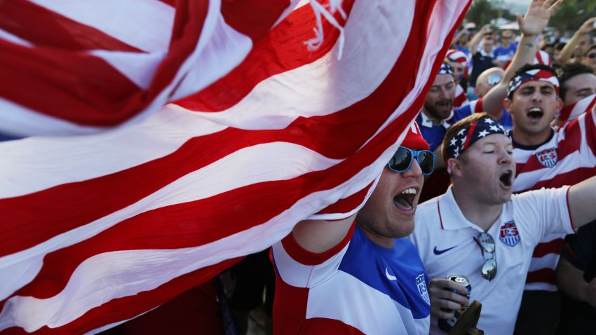 Fans of the U.S. national soccer team gather to cheer before the group G World Cup match between United States and Portugal, on Copacabana beach, in Rio de Janeiro, Brazil, Sunday, June 22, 2014. (AP Photo/Leo Correa)