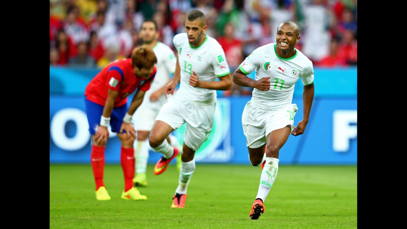 Yacine Brahimi of Algeria, right, celebrates scoring his team's fourth goal during a World Cup game against South Korea at Beira-Rio Stadium in Porto Alegre, Brazil. Algeria won 4-2, its first World Cup victory in 32 years.