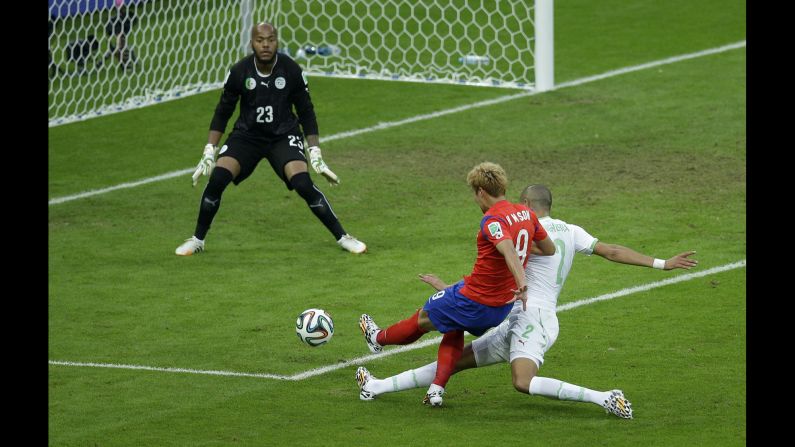 South Korea's Son Heung-min shoots and scores his team's first goal.