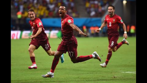 Portugal's Nani, center, celebrates scoring a goal against the United States. He scored on a cross about 6 yards out from the goal.