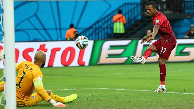 Nani of Portugal scores his team's first goal past U.S. goalkeeper Tim Howard. Portugal took a 1-0 lead in the fifth minute of the match.