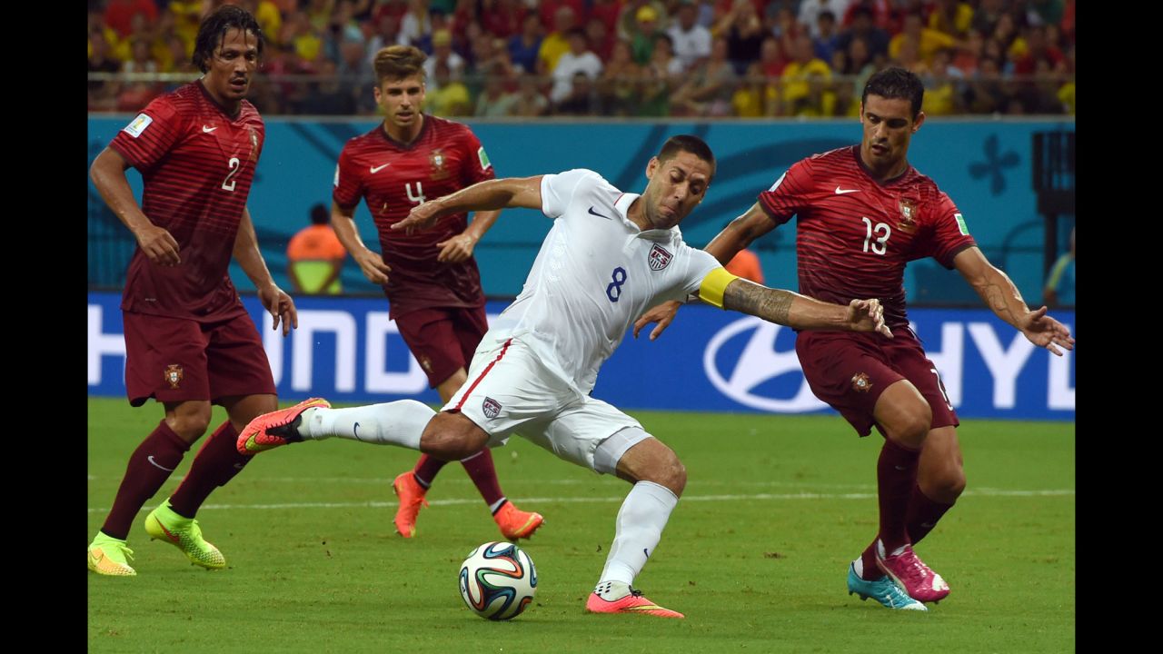 Clint Dempsey is challenged by several Portugal players during the action on June 22.