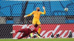 Silvestre Varela of Portugal scores his team's second goal as goalkeeper Tim Howard of the United States looks on.