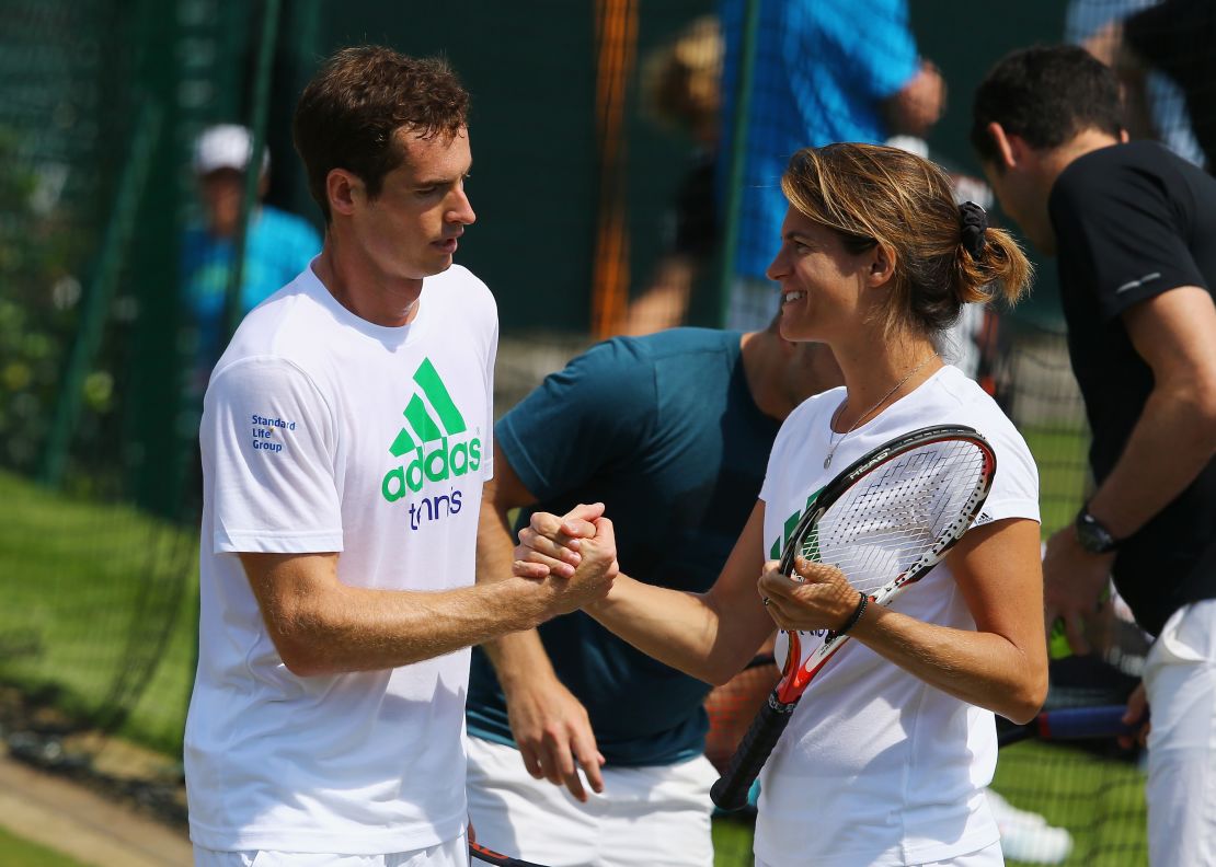 Murray talks with Mauresmo during a practice session for Wimbledon in 2014.