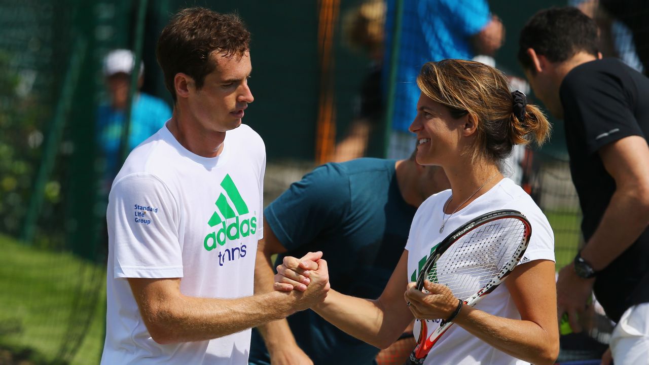 Murray talks with Mauresmo during a practice session for Wimbledon in 2014.