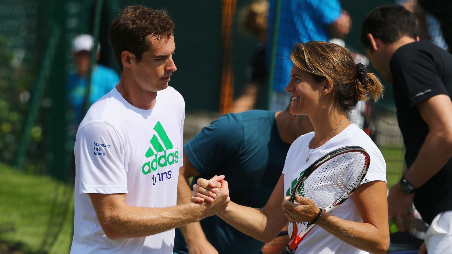 Andy Murray talks with coach Amelie Mauresmo during a practice session for the Wimbledon Championships.