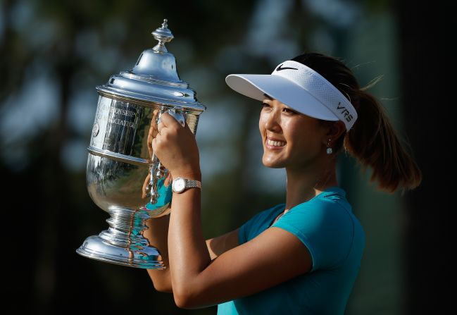 Michelle Wie of the United States poses after her two-stroke victory at the 69th U.S. Women's Open at Pinehurst Resort & Country Club.