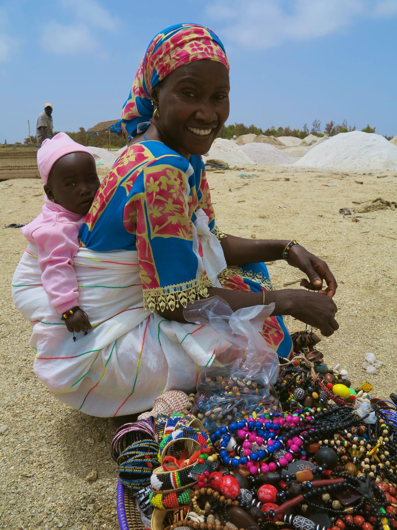 A woman selling jewelry on the shore of Lake Retba.