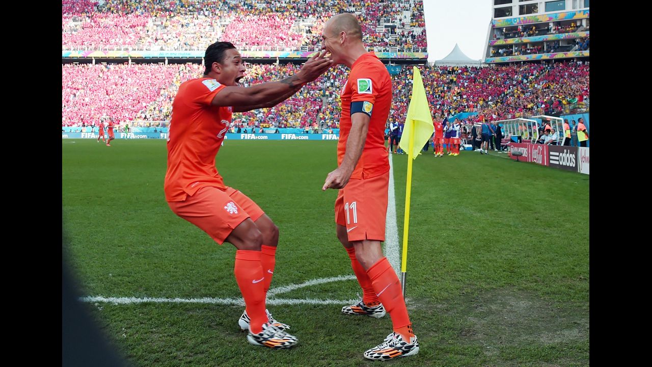 Netherlands forward Memphis Depay, left, celebrates scoring with Arjen Robben during a World Cup match against Chile in Sao Paulo. Netherlands beat Chile 2-0.