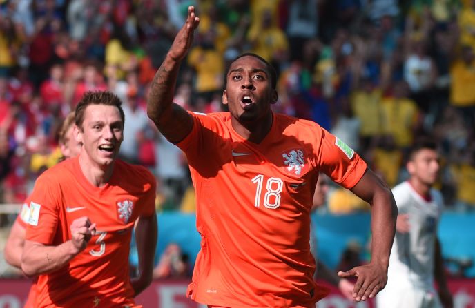 Netherlands midfielder Leroy Fer, right, celebrates scoring with his teammates.