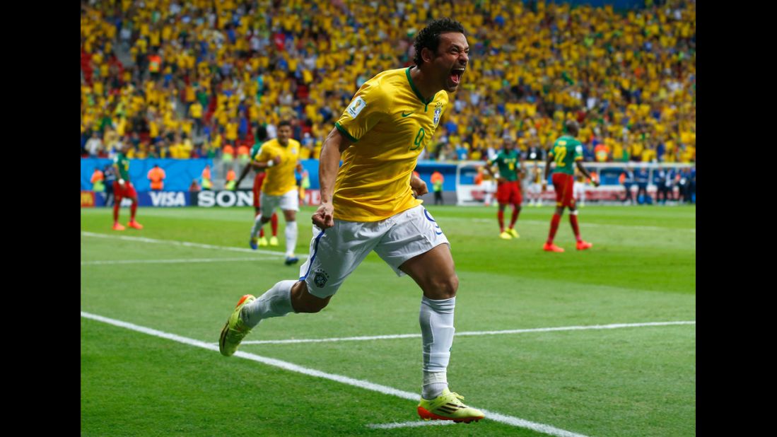 Fred of Brazil celebrates scoring his team's third goal during a match against Cameroon.
