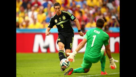 Spain's Fernando Torres scores his team's second goal past Australian Mathew Ryan.