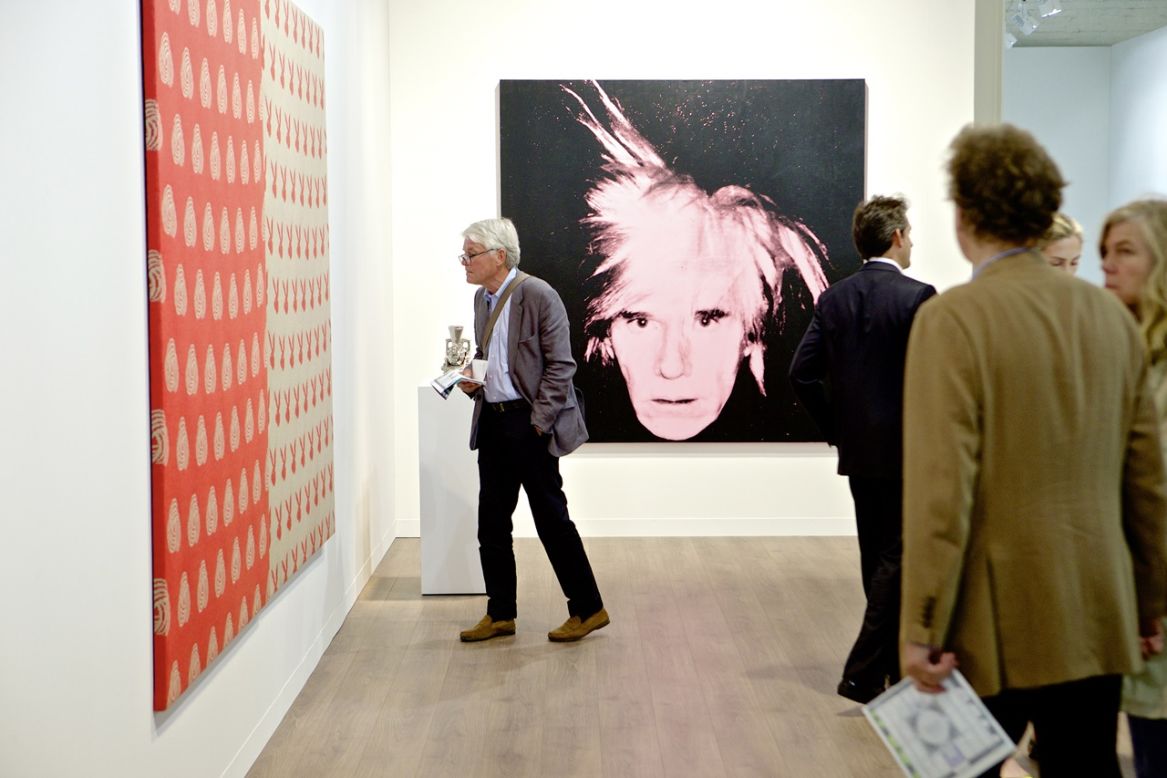 <em>"Self-Portrait (Fright Wig)" (1986) by American artist Andy Warhol</em><br /><br />The event has a decidedly international flair, and not just when it comes to galleries and artists represented -- collectors from Asia, Middle East, North America and Eastern Europe all fly in to the picturesque Swiss town specially for the show. They do more than just browsing -- this year's biggest sale was a self-portrait by the legendary American pop-artist Andy Warhol, shown above, which went for $35m. 