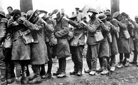 Men of the British Army's 55th Division, blinded by a poison gas attack, in April 1918. British soldier Wilfred Owen captured the panic of an attack in verse "Gas! Gas! Quick, boys! -- An ecstasy of fumbling, Fitting the clumsy helmets just in time; But someone still was yelling out and stumbling, And flound'ring like a man on fire or lime."
