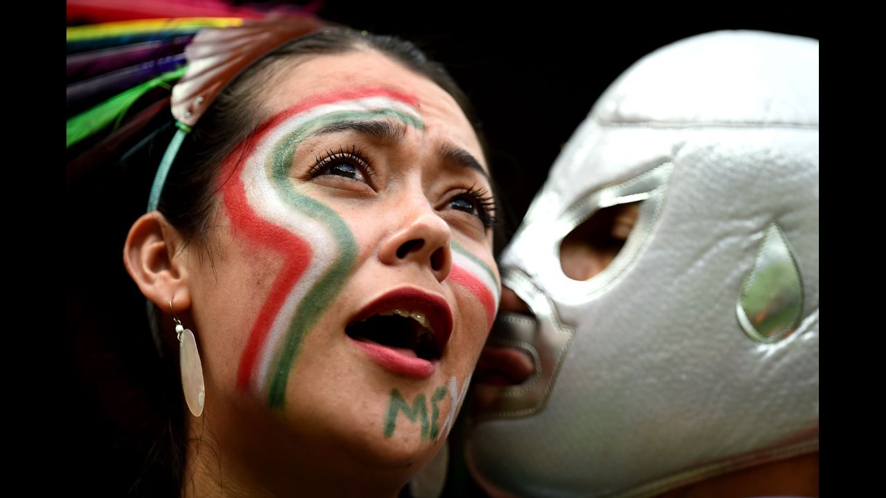 A Mexico fan receives a kiss during the match against Croatia.