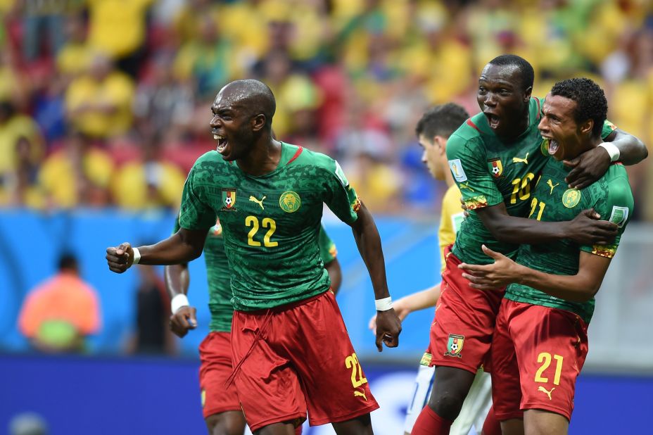Cameroon midfielder Joel Matip, right, celebrates with Allan Nyom and Vincent Aboubakar after scoring a goal against Brazil.