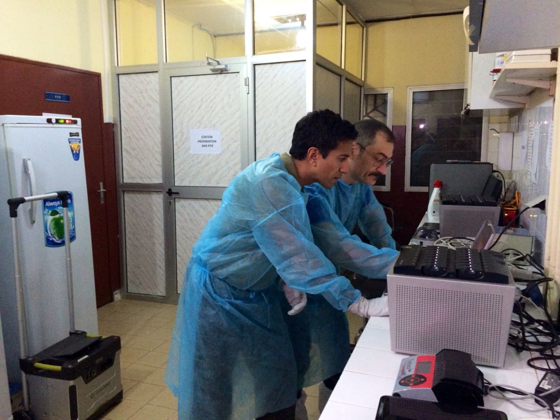 Dr. Sanjay Gupta works in the World Health Organization's mobile lab in Conakry, Guinea. 