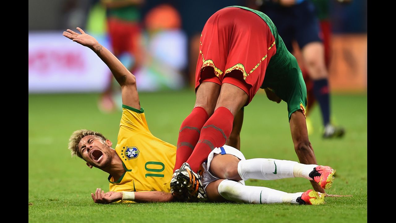 BRASILIA, BRAZIL - JUNE 23: Joel Matip of Cameroon collides with Neymar of Brazil during the 2014 FIFA World Cup Brazil Group A match between Cameroon and Brazil at Estadio Nacional on June 23, 2014 in Brasilia, Brazil.  (Photo by Buda Mendes/Getty Images)