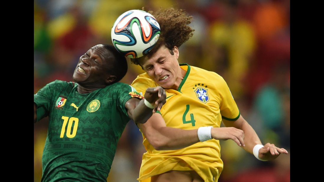 Brazilian defender David Luiz, right, vies with Cameroon forward Vincent Aboubakar.