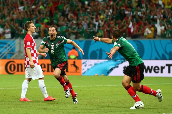 Andres Guardado of Mexico, center, celebrates after scoring the second goal against Croatia.