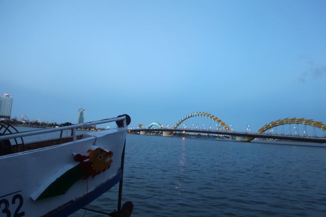 Boat tours make the most of the bridge's popularity -- prows are painted with the dragon's likeness. 