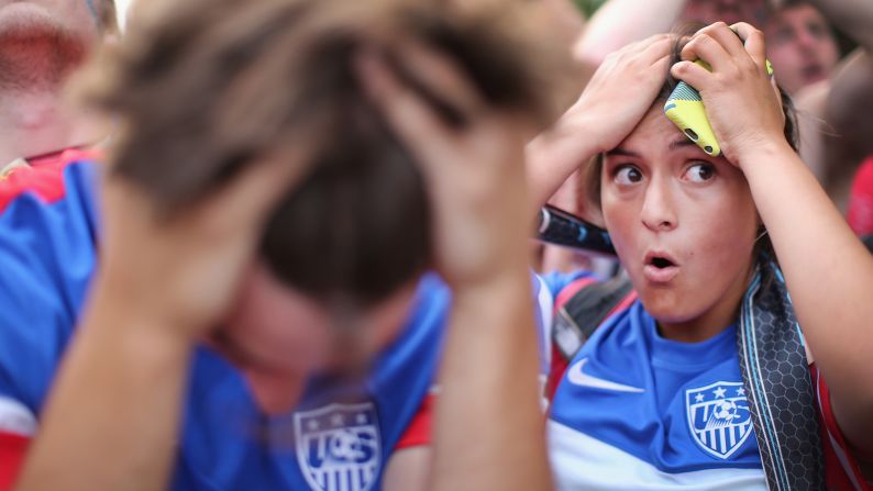 Fans in Chicago react after Portugal tied the United States in the final seconds of their group-stage match on Sunday, June 22.