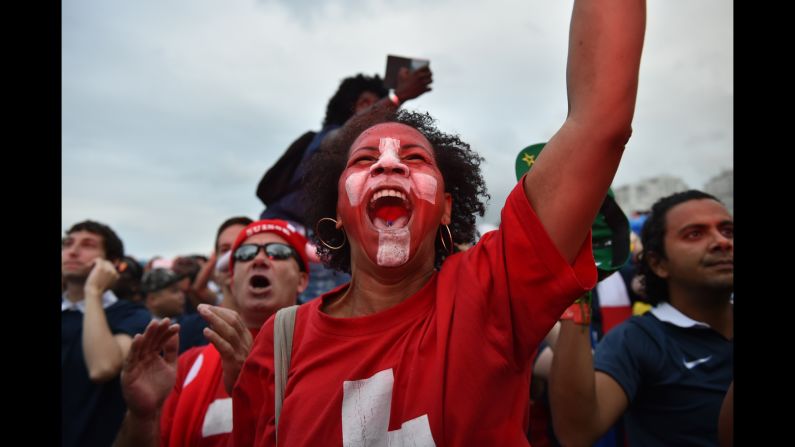 Switzerland supporters cheer while watching their team play against France on Friday, June 20. France won the match 5-2.