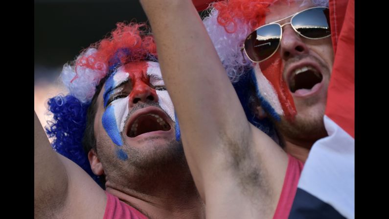 Supporters of the Costa Rican soccer team cheer before their game against Uruguay on Saturday, June 14. Costa Rica upset Uruguay 3-1.
