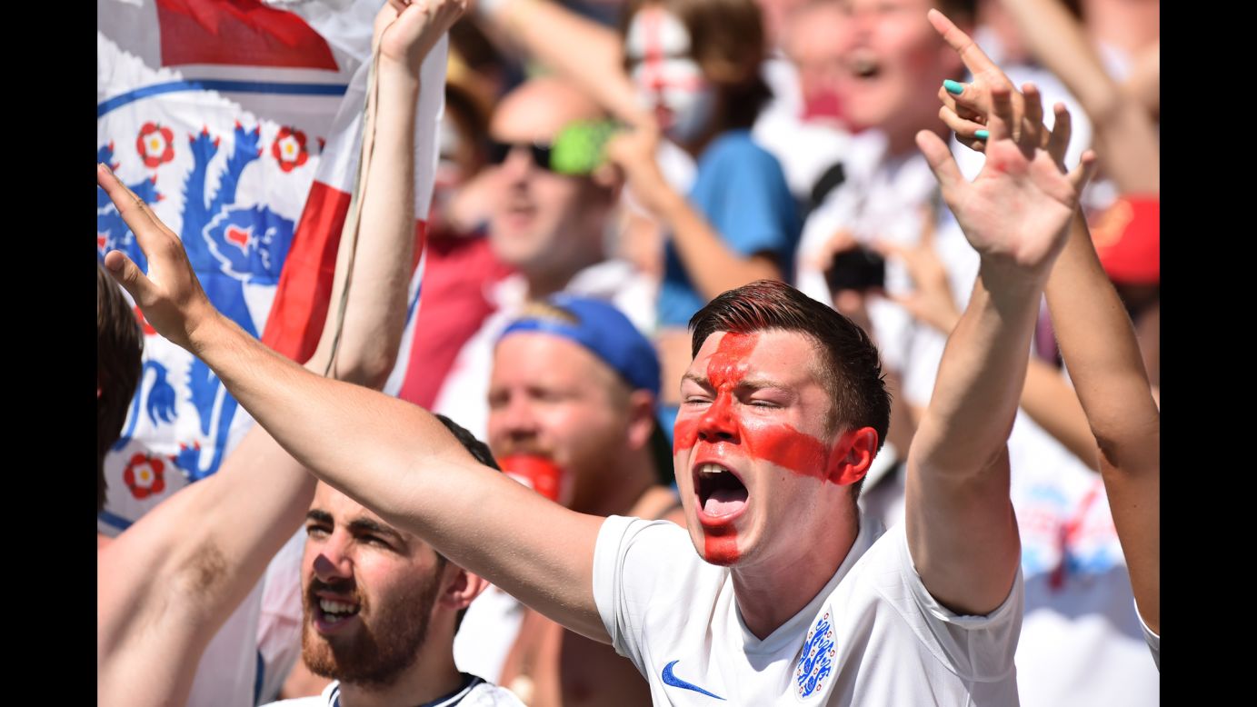 England supporters cheer for their team before the match against Costa Rica. 