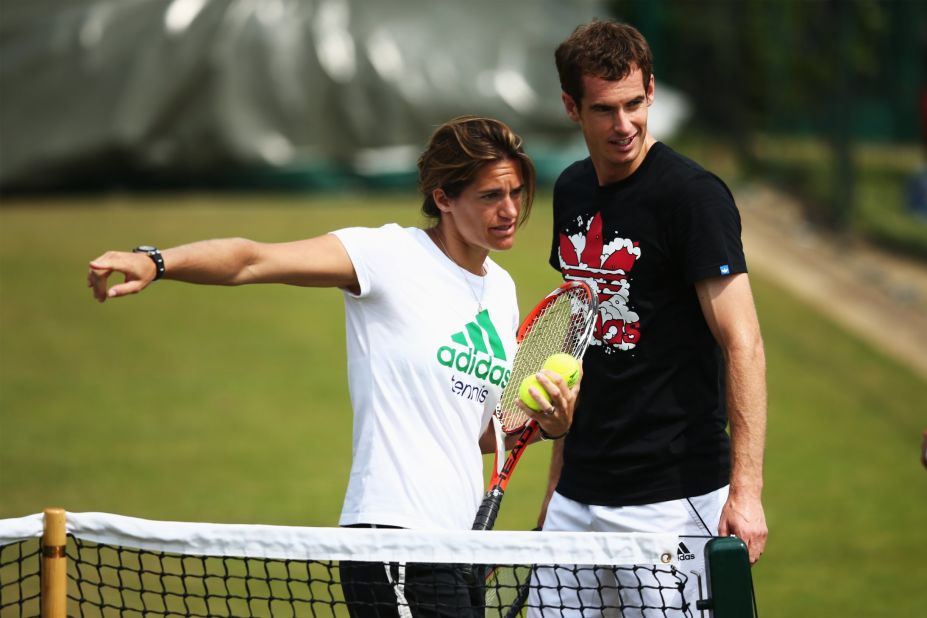 Andy Murray talks with coach Amelie Mauresmo during a practice session ahead of Wednesday's second-round match against Blaz Rola.